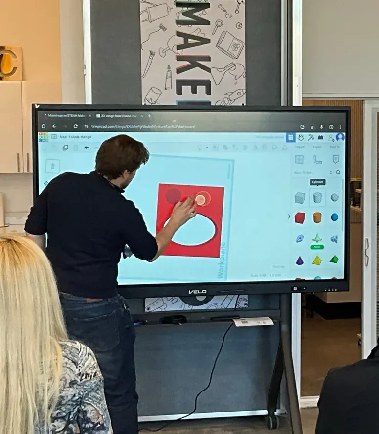 A person writing on Veld Board with a stylus